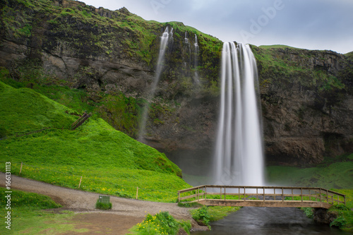 Iceland - Waterfalls of Seljalandsfoss with bridge and river and stairs