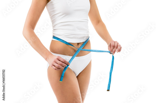Woman measuring waist isolated on white background