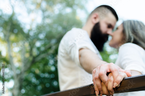 touching and holding couple hands