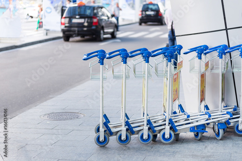 Luggage carts at the entrance of international airport terminal
