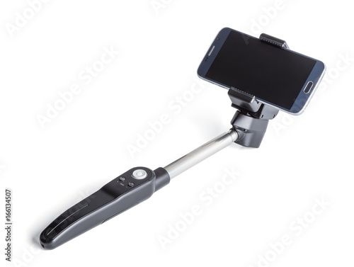 Smart phone on a selfie stick shot in studio, isolated over the white background and clipping path