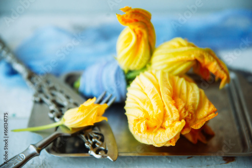 group of zuchcini flowers on wooden background