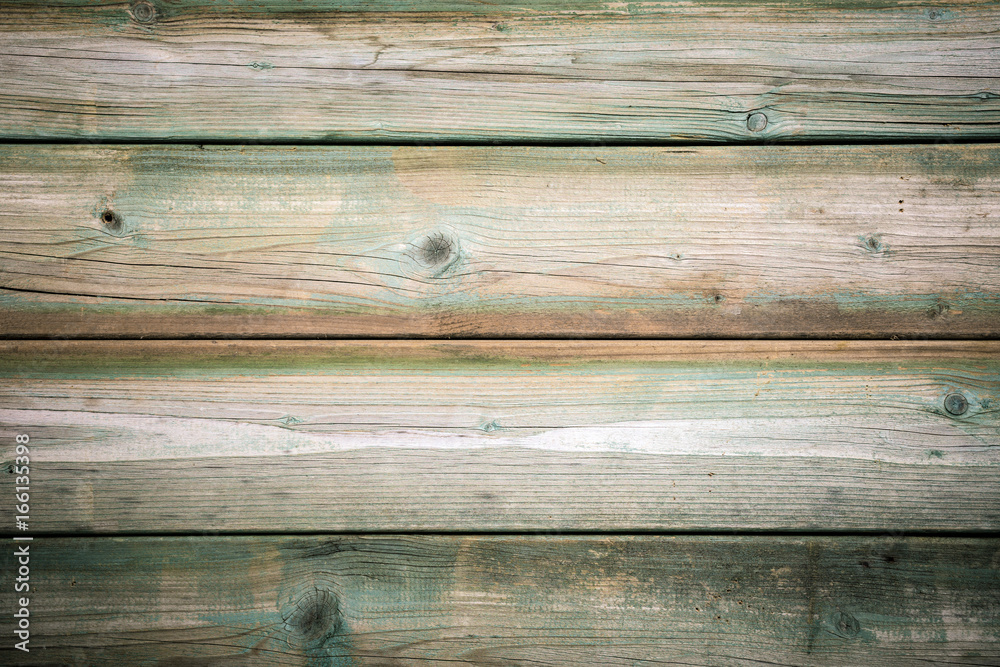 Fototapeta premium Grunge background of old green wooden plank. Horizontal stripes