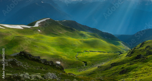 Fotografie, Obraz Green river valley in beams of evening sun. Caucasus mountains.