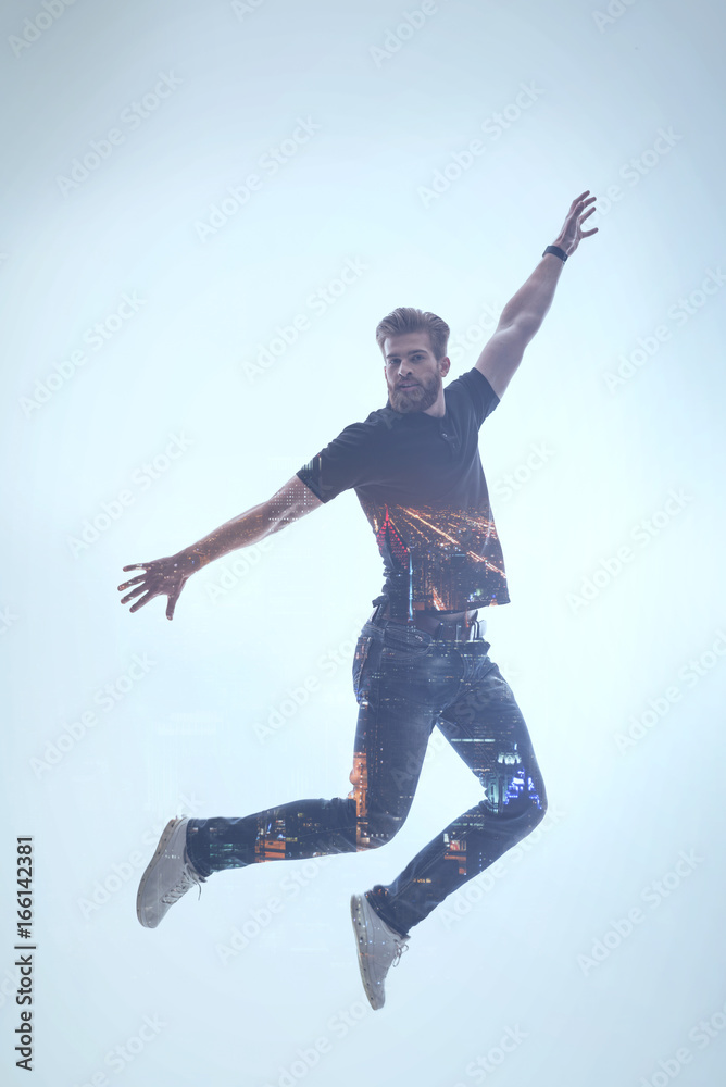 Excited bearded guy feeling freedom during flight