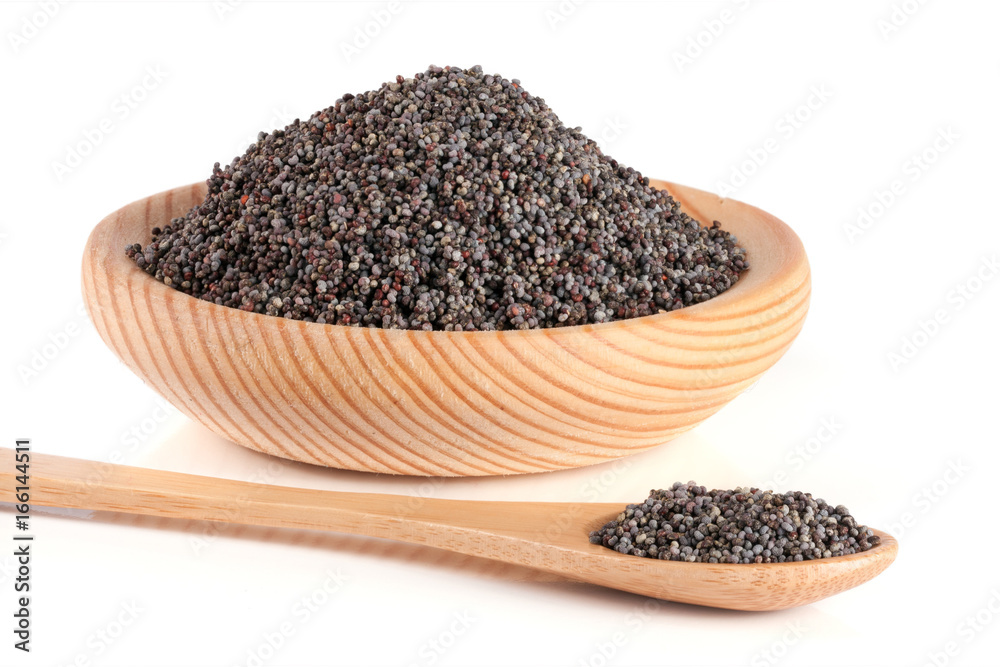 poppy seeds in a wooden bowl and spoon isolated on white background
