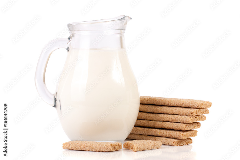 jug of milk with stack of grain crispbreads isolated on white background jug of milk with stack of grain crispbreads isolated on white background
