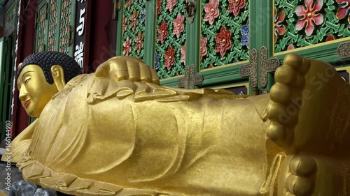 Busan, South Korea-02 July, 2017: 4K Entrance of Daegaksa a Buddhist temple of the Jogye Order in Busan. The golden Amita-bul lying on the main altar, Buddha of the Western Paradise. South Korea.-Dan photo