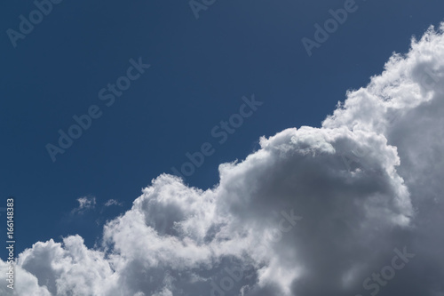 Tableau sur toile The sky is divided diagonally Cumulus clouds and clear sky.