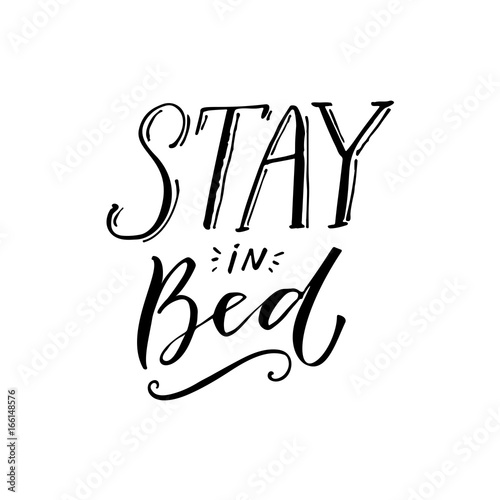 Stay in bed. Black lettering design on white background. Funny caption for t-shirt and posters
