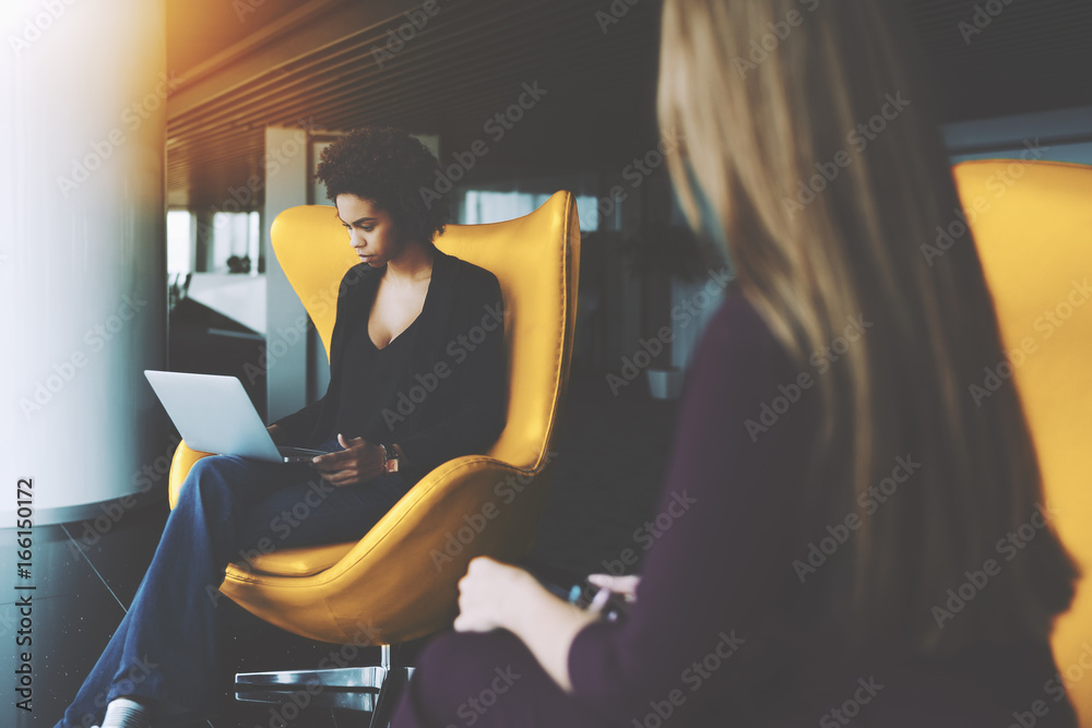 Φωτογραφία Young pensive beautiful Brazilian woman entrepreneur with afro hair is sitting w