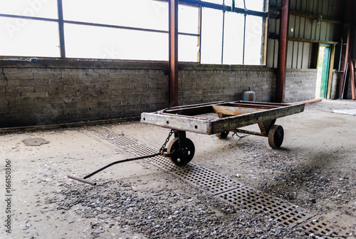 Old wooden hand cart trolley in a warehouse