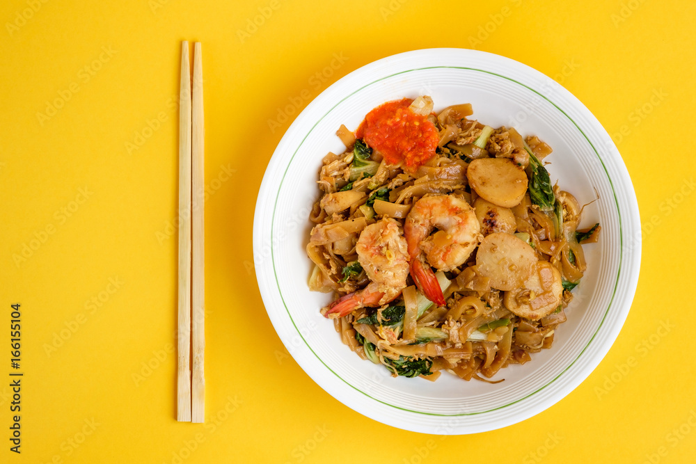 Stir fried flat rice noodle or char kway teow that is famous among Indonesian, Malaysian and Singaporean as breakfast or another meal