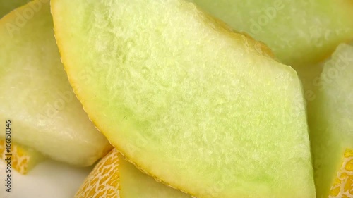 Honeydew Melon on a rotating wooden plate (seamless loopable; 4K)