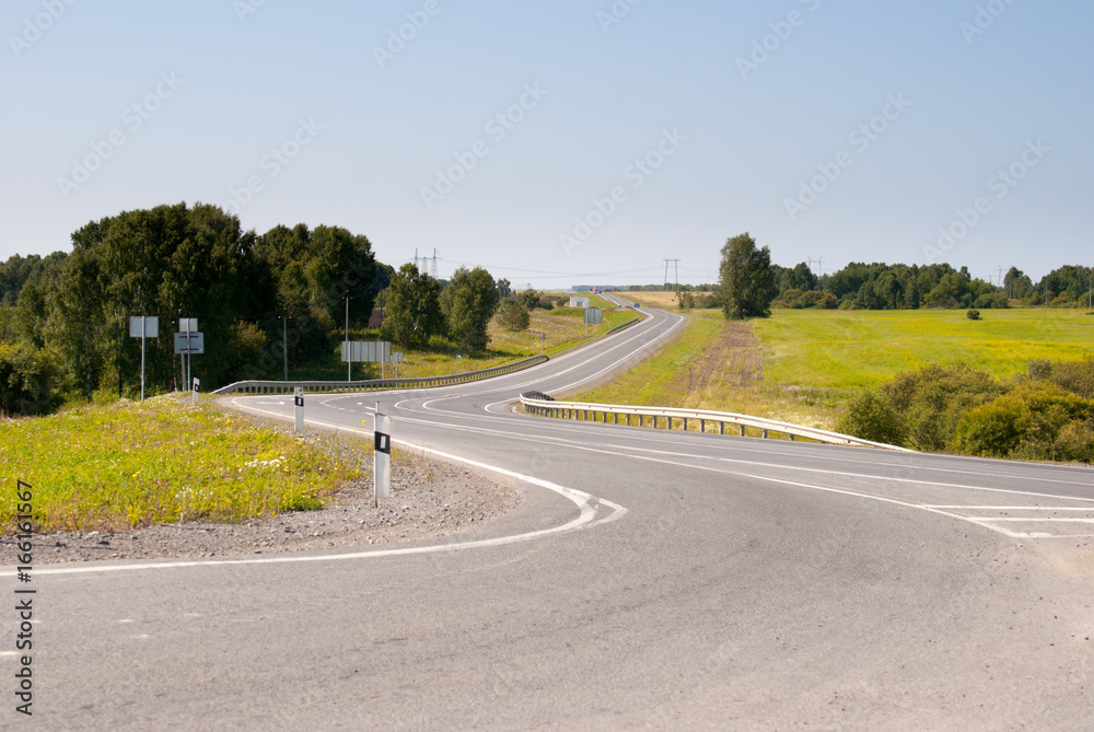 Fototapeta premium curved country asphalt road