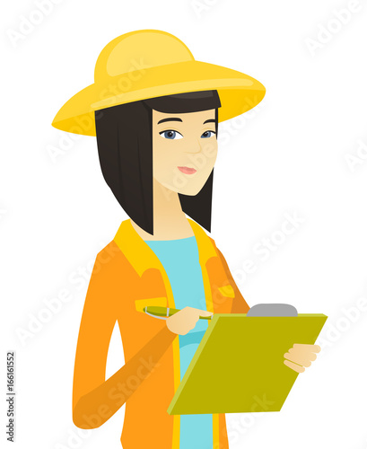 Young asian farmer writing on clipboard.