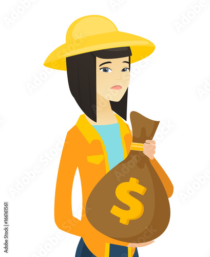 Upset young asian farmer holding a money bag.