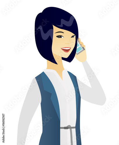 Asian business woman talking on a mobile phone.