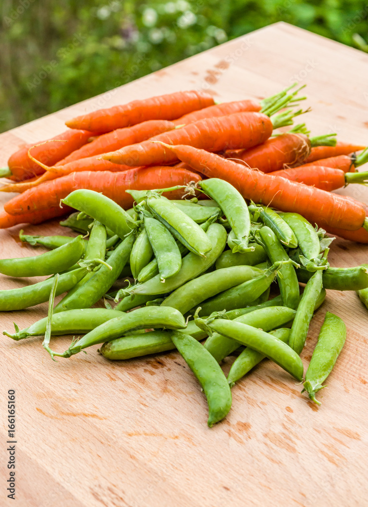 Fresh peas and carrots from the garden Fresh peas and carrots from the garden