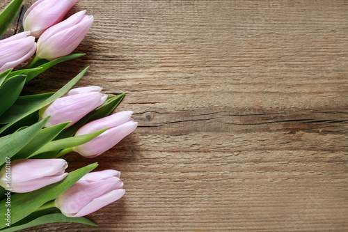Fototapeta Naklejka Na Ścianę i Meble -  Beautiful pink tulips on wooden background