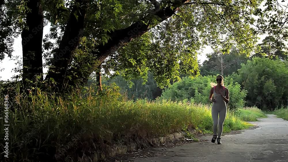 Woman Running in the Sunny Park. Woman Running in the Sunny Park.
