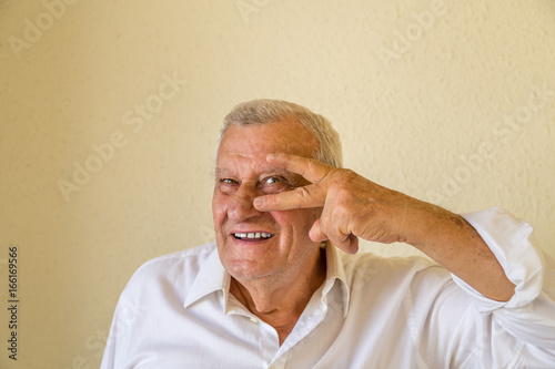 Old male model showing rock gesture