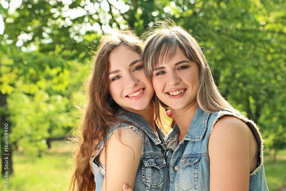 Portrait of two young woman in the park Portrait of two young woman in the park
