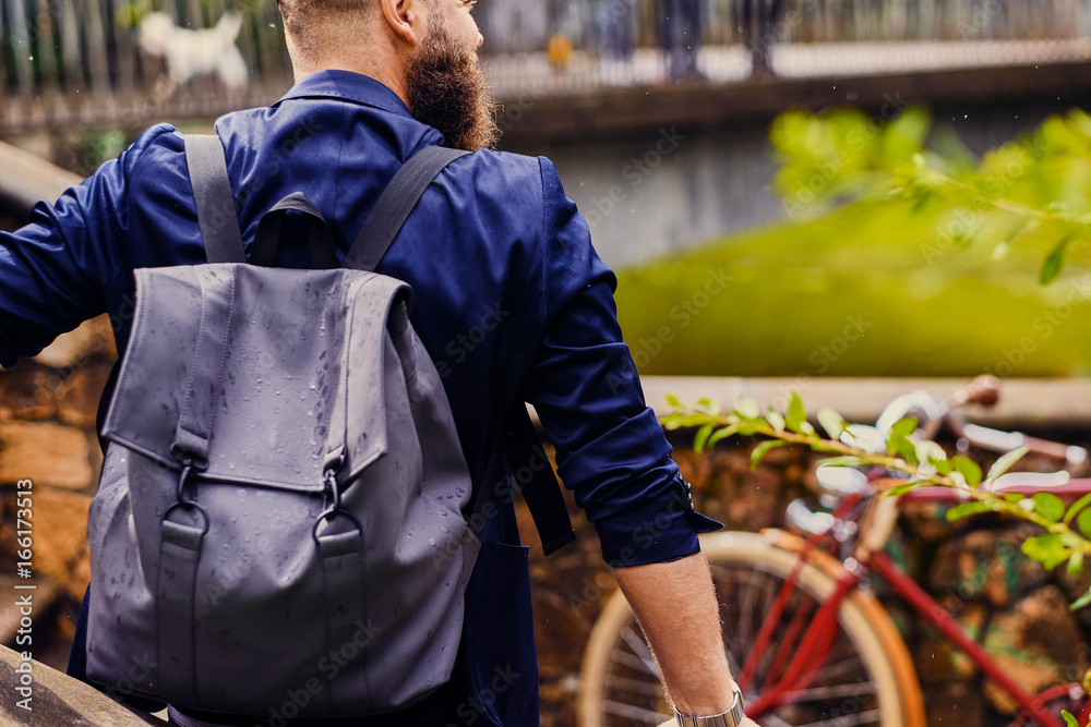 Casual modern guy with backpack. Back view. Casual modern guy with backpack. Back view.
