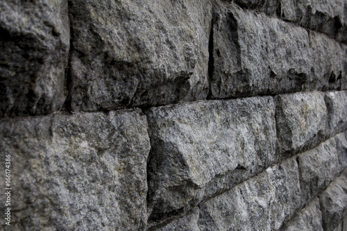 Gray stone wall. Textured background closeup.