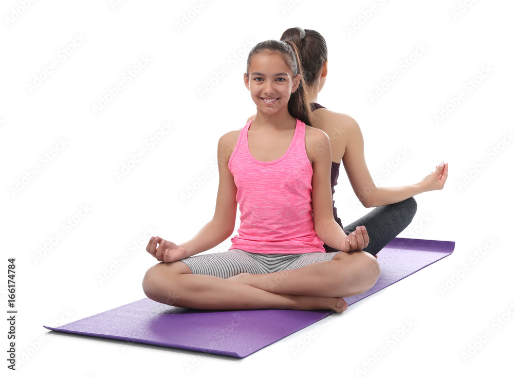 Mother and daughter doing exercise on white background