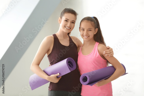 Mother and daughter standin...
