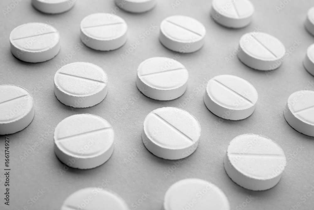 Health care concept. Pills on grey background Health care concept. Pills on grey background