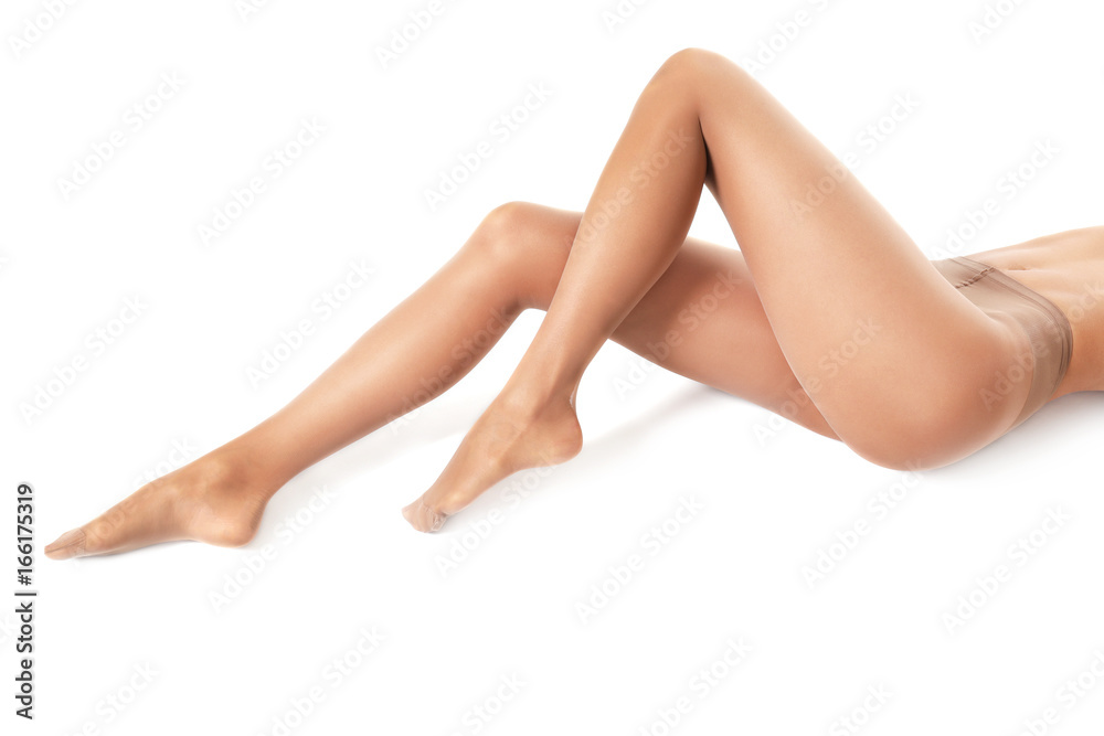 Legs of beautiful young woman in tights on white background - obrazy, fototapety, plakaty 