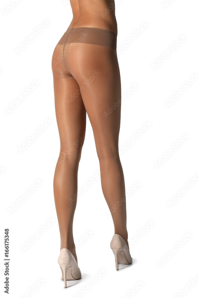 Legs of beautiful young woman in tights on white background Legs of beautiful young woman in tights on white background