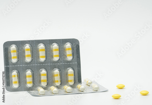 Anti-inflammatory medicine capsule pills on white background photo