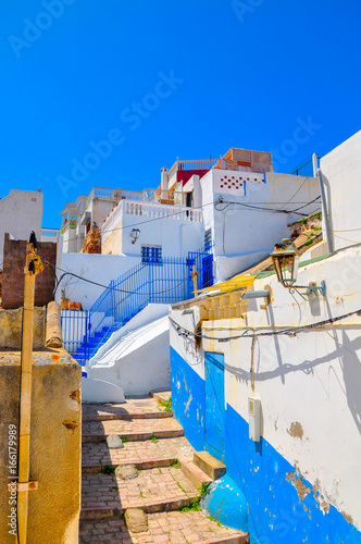 historical quarter of the city of Rabat in bright sunny day, houses are painted I white and blue colors