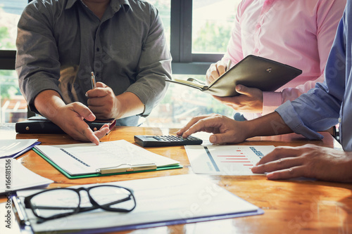 Administrator business man financial inspector and secretary making report, calculating or checking balance.