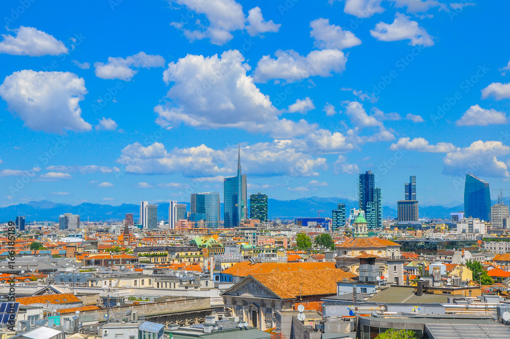 panorama of the city of Milan from a building roof, in are far in the country the mountain ridge is seen