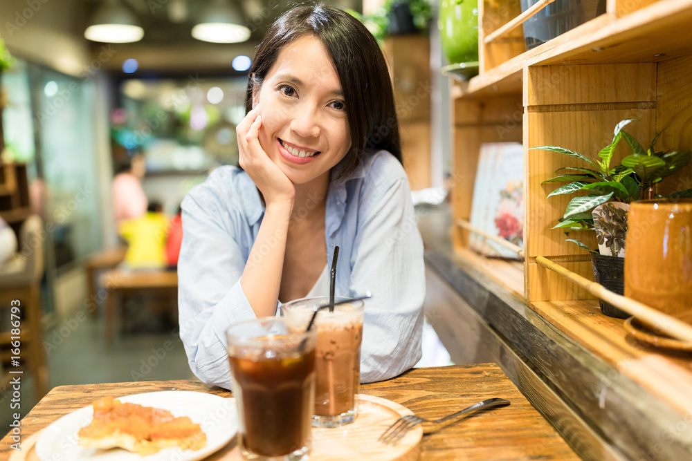 Woman enjoy her food in coffee shop