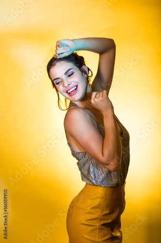 Beautiful woman posing in disco lights