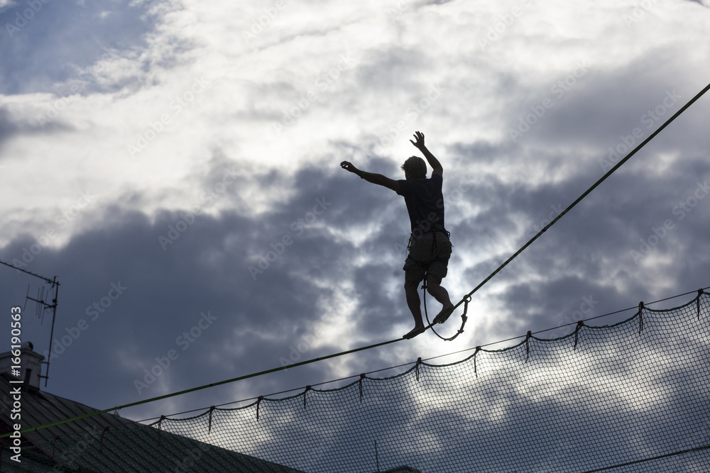 LUBLIN - JULY 28: Man practicing highline in Lublin during Urban High ...