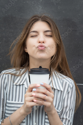 Beautiful girl with a glass of coffee