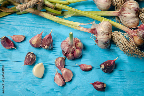 Fresh carrots on a blue wooden table photo