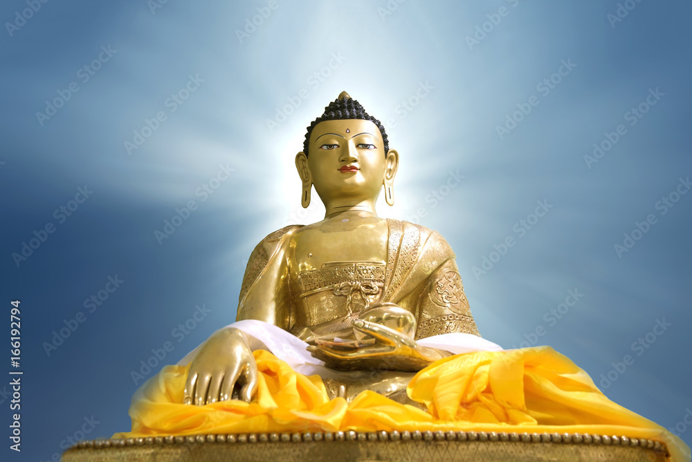 Fototapeta premium Buddha statue on blue sky