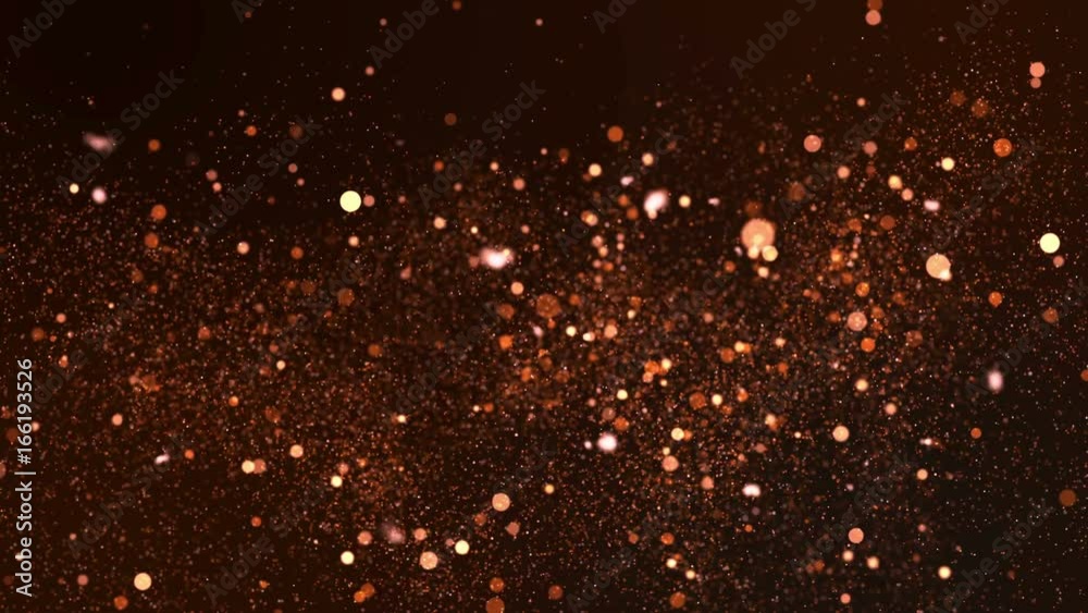 Glittering sparks flying in a blurred background. 4K UHD video loop animation.
