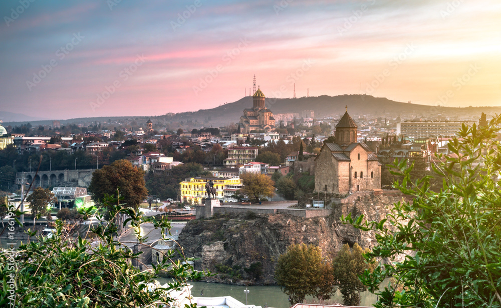 amazing sunset view of Tbilisi with mountains on the background, Georgia