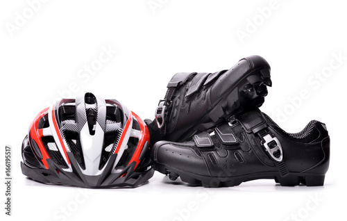 Mountain bike cycling shoes and helmet isolated on white background.