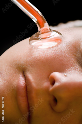 Beauty treatment of face skin with high frequency infrared spot remover in SPA center photo