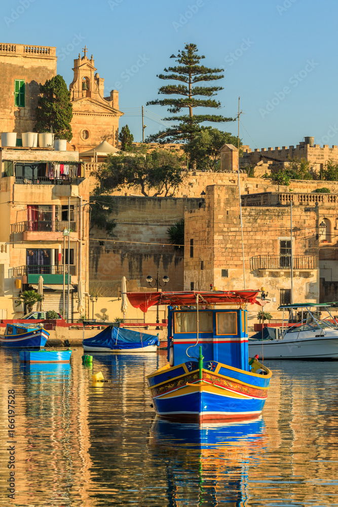 Maltese traditional boat in fishing village