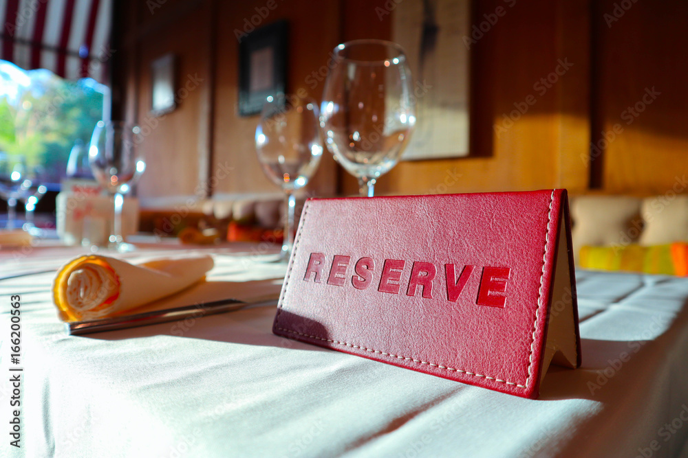 Reservation sign card in the luxury restaurant. Reserved table in at the  cafe. Stock Photo | Adobe Stock